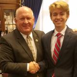 Congressman Thompson shaking hands with a young man in his office