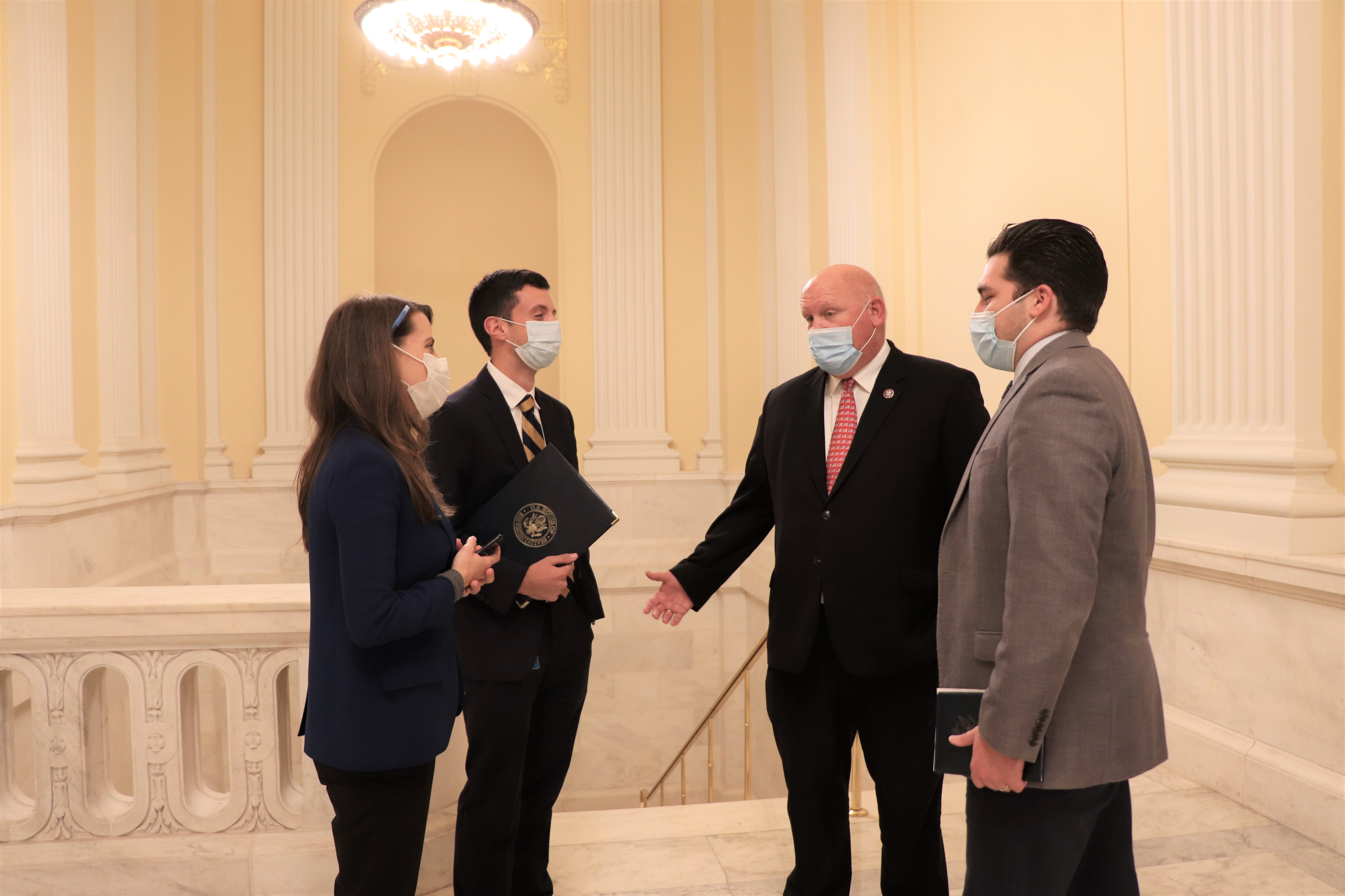 Congressman Thompson speaks with staff